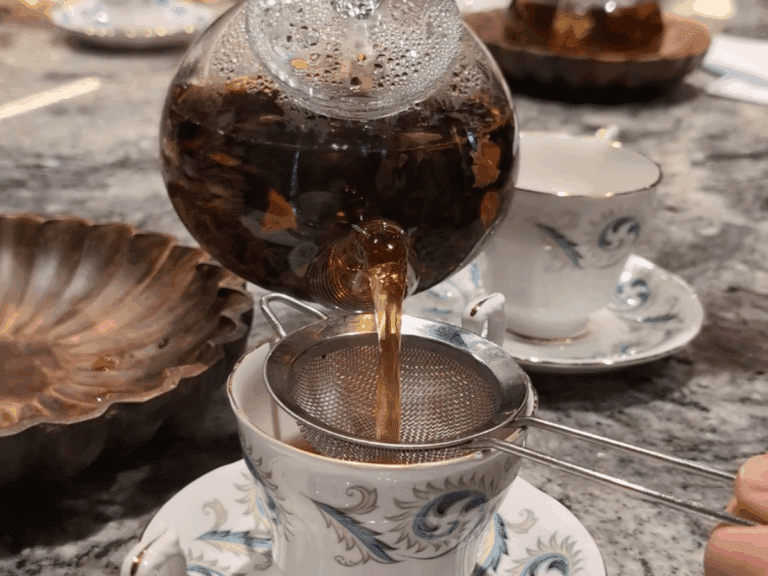 Pouring loose leaf tea during the tasting 768x576